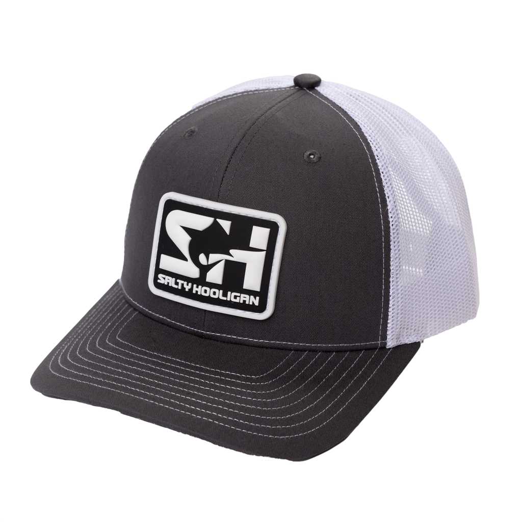 Rubber Logo Trucker hat in charcoal with white mesh, three-quarter front view