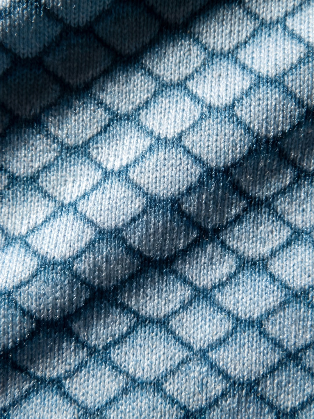 Close-up of the pale blue fish scale print fabric