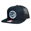 Flat bill trucker cap in navy with round Salty Hooligan patch, side view