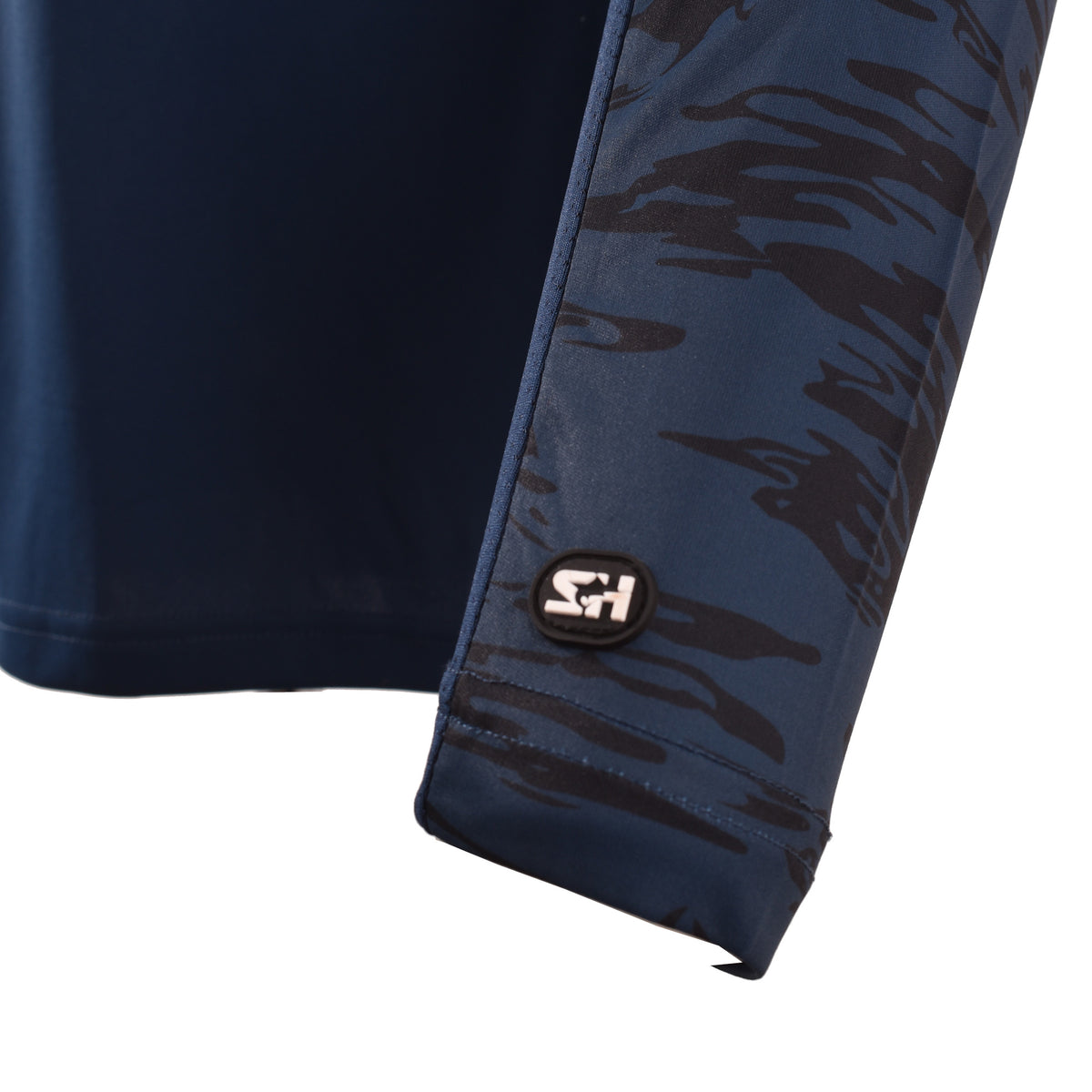 Close-up of the SH logo on the camo sleeve cuff