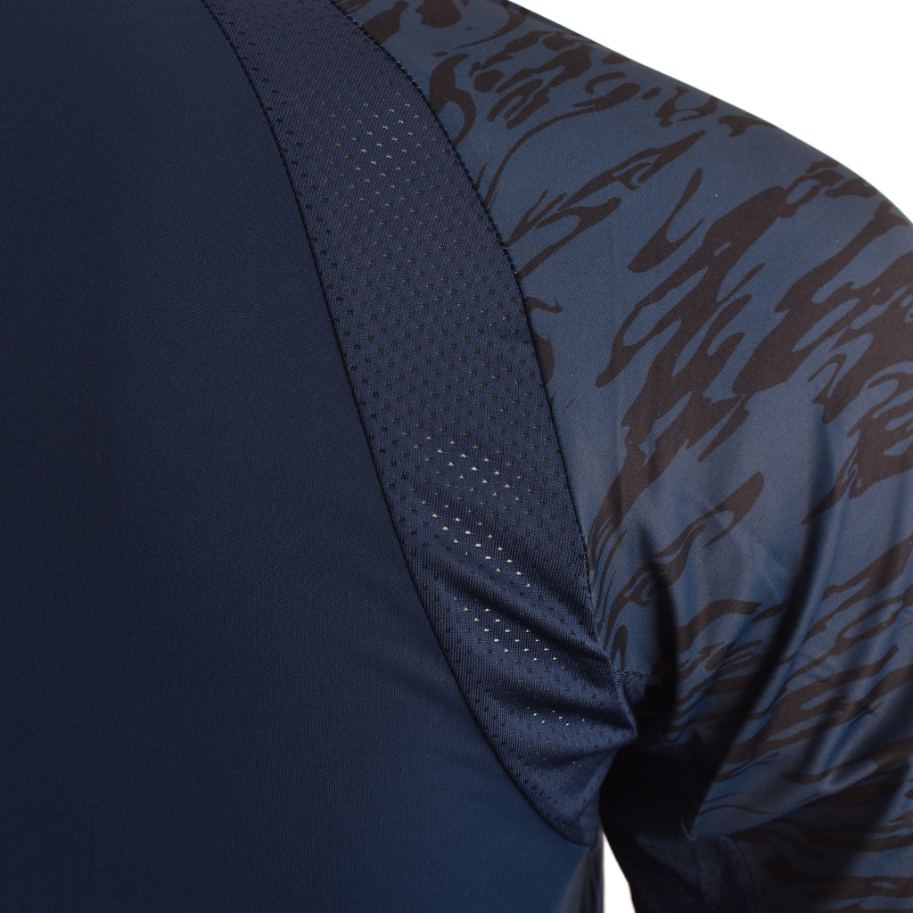 Close-up of the mesh shoulder panel and navy camo sleeve
